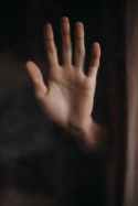 persons left hand on window